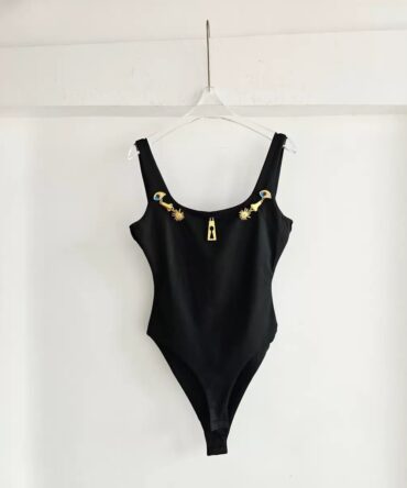 Elegant sleeveless bodysuit featuring luxe gold hardware details and a flattering square neckline. Designed with a sleek fitted silhouette for a chic, statement look.